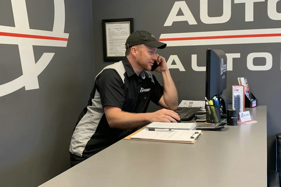 Shop owner on the phone at the front desk